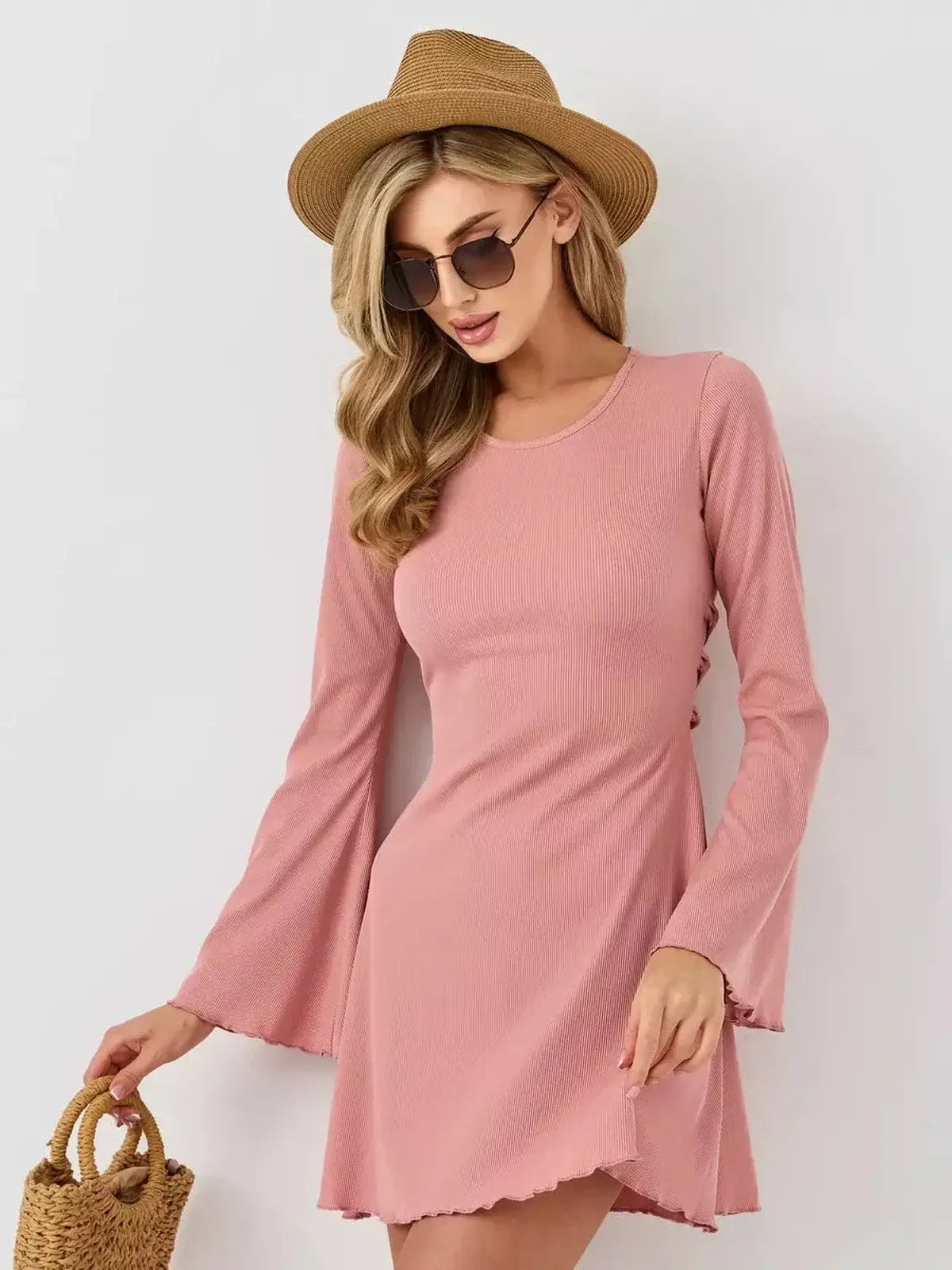 Blush Aura mini dress by Lauven in pink, featuring a U-neckline and flared long sleeves, perfect for summer elegance.