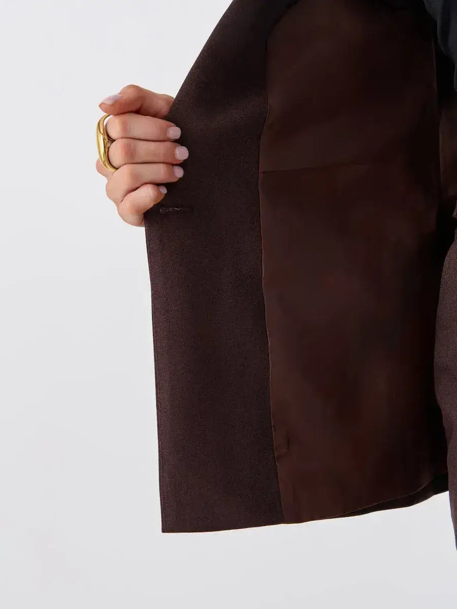 Cacao Suit Set by Lauven showcasing the interior of a tailored chocolate vest for a stylish ensemble.