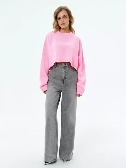 Candy Sweater by Lauven in soft pink, cropped oversized knit, paired with wide-leg jeans.