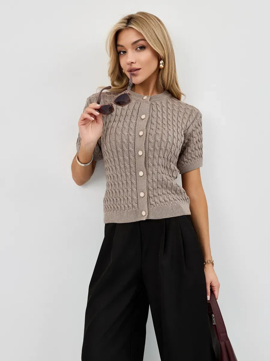 Capri Cardigan in cappuccino worn by model, featuring short sleeves and a stylish button-up design by Lauven.