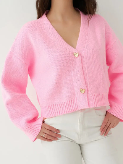 Celeste Cardigan by Lauven, cropped pink knit sweater with heart buttons, ideal for casual and polished outfits.