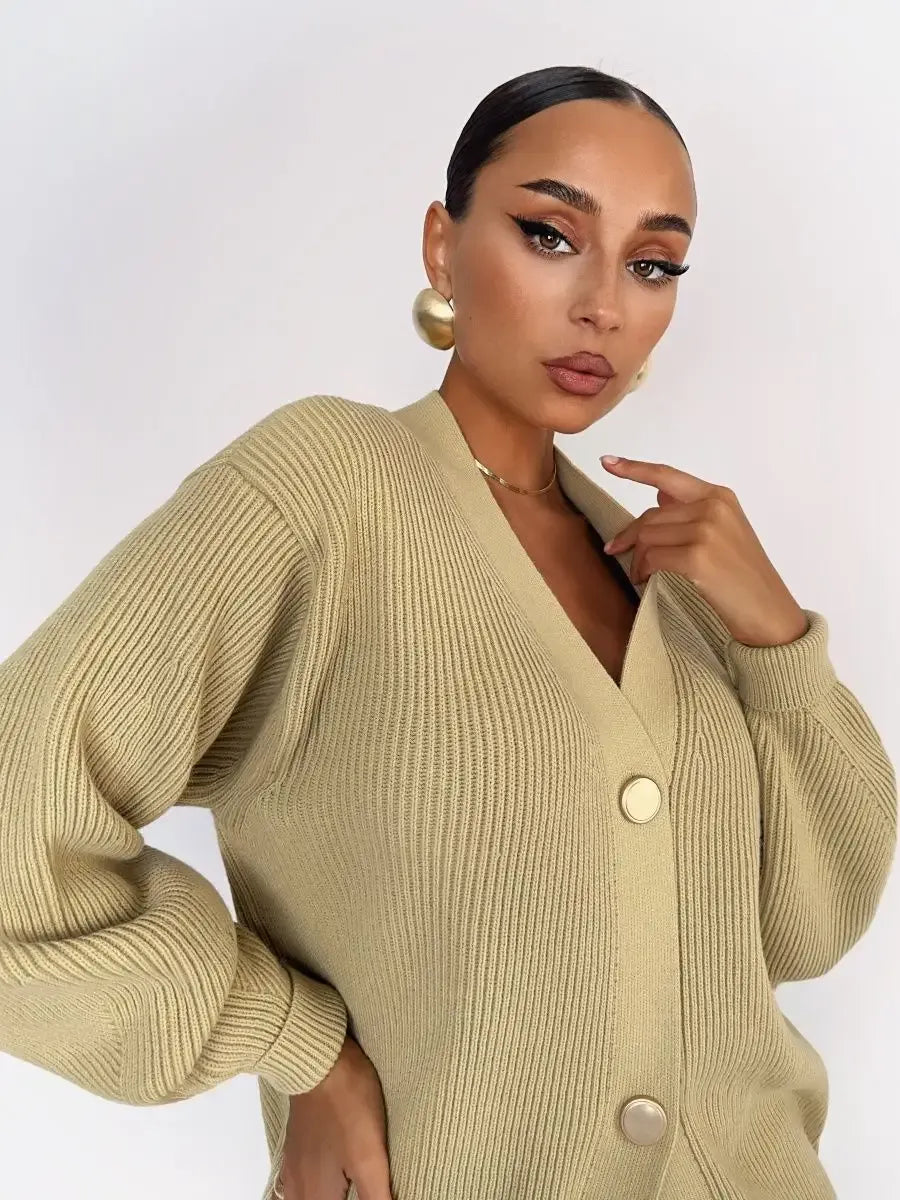 Celeste Cardigan by Lauven, a longline oversized knit in warm beige with elegant button details.