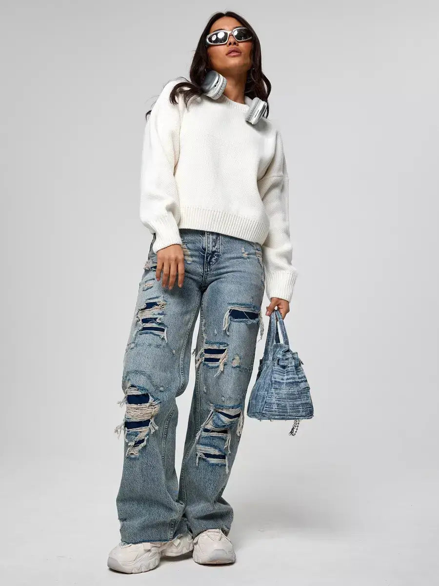 Celeste Pullover oversized cropped women’s sweater by Lauven, styled with distressed jeans and a handbag.
