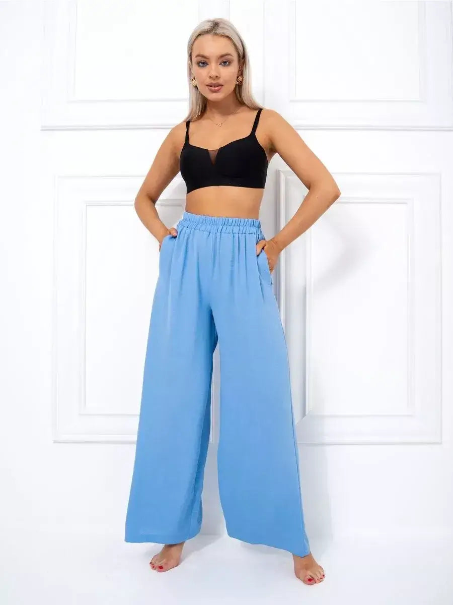 Celeste Suit Set model showcasing elegant oversized wide-leg palazzo pants in soft blue by Lauven
