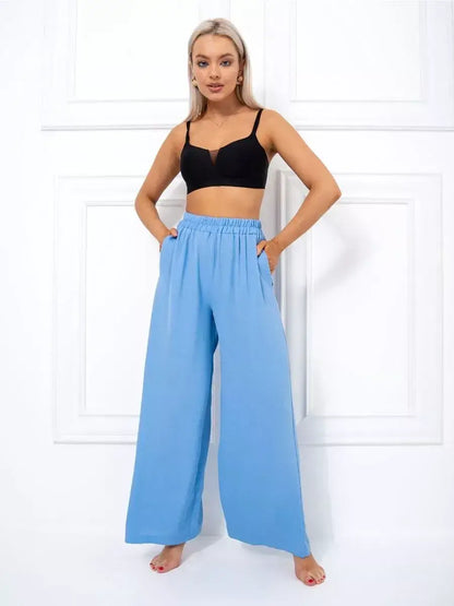 Celeste Suit Set model showcasing elegant oversized wide-leg palazzo pants in soft blue by Lauven