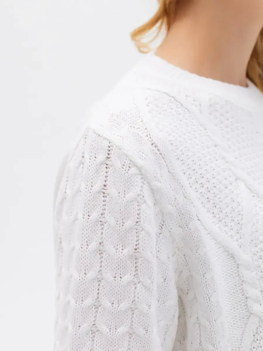 Celeste Sweater by Lauven, elegant white knitwear featuring patterned sleeves and a sophisticated cable knit design.