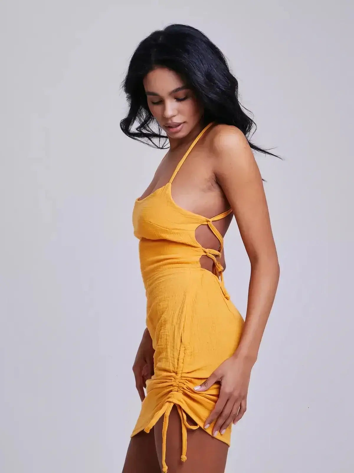 Lauven Citrus Rush summer dress in yellow, showcasing adjustable crisscross straps and a flattering bodycon silhouette.