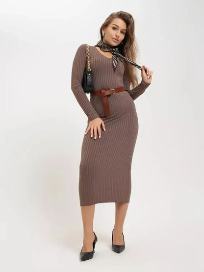 Contemporary woman modeling the Contour Midi Dress by Lauven, showcasing ribbed elegance and a sculpted fit.