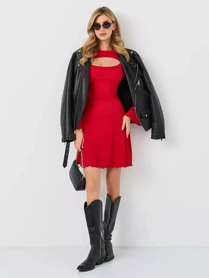 Model wearing a Flare Cutout Mini by Lauven, featuring a red A-line silhouette and stylish black leather jacket.