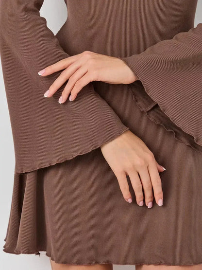 Lauven Flare Hour Mini dress detail showcasing bell sleeves and flared hem in soft ribbed knit.