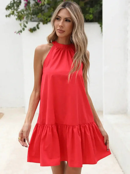 Model wearing a stylish red halter neck mini dress with flounced hem and ruched collar for summer fashion.