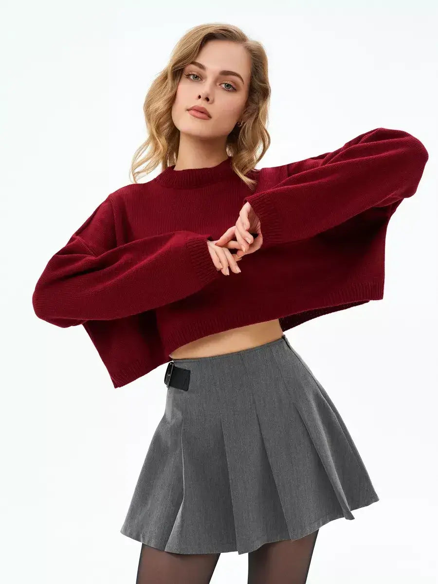 Garnet Sweater by Lauven in deep burgundy, showcasing cropped oversized knit style paired with a gray skirt.