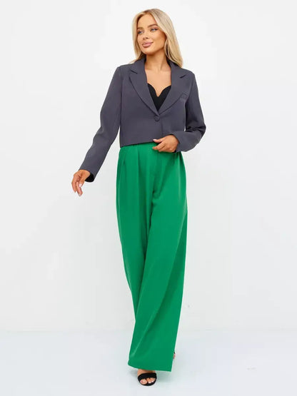 Graphite Blazer by Lauven, a cropped tailored classic in dark gray, styled with green wide-leg pants.