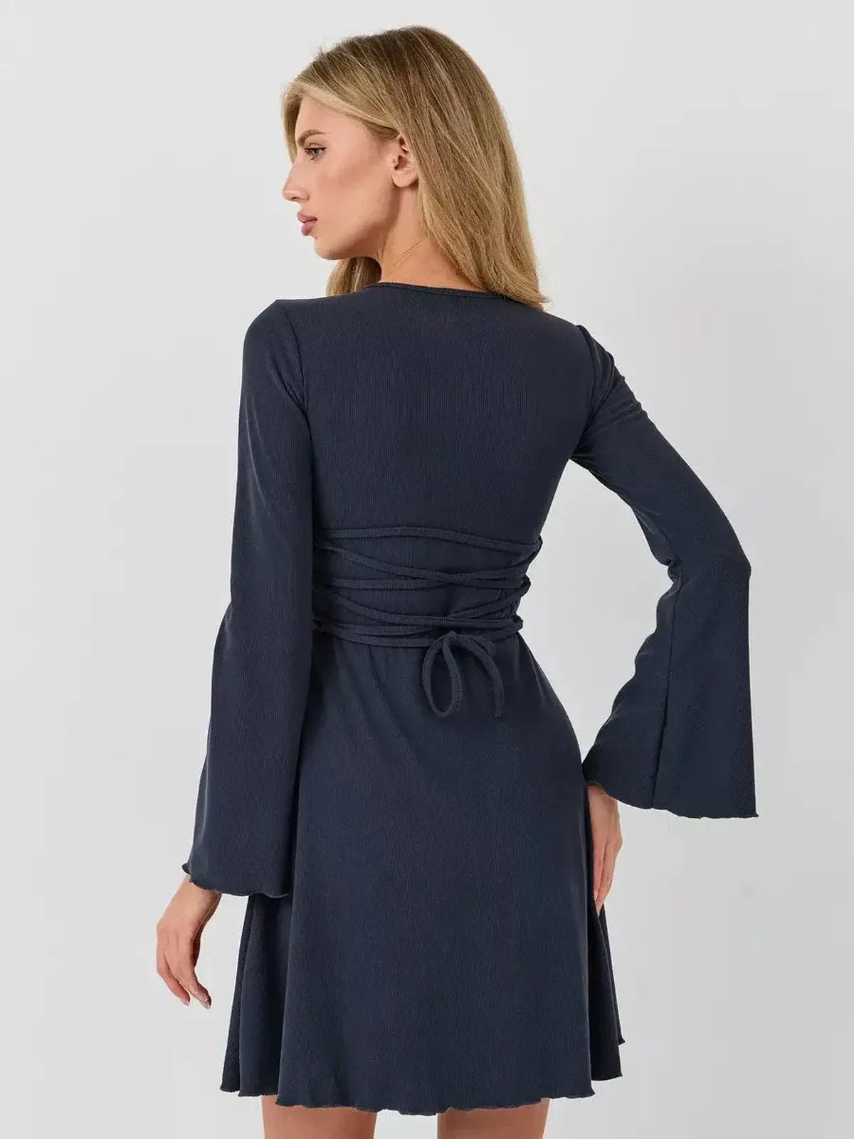 Graphite Grace mini dress by Lauven, showcasing a sleek A-line silhouette with lace-up back detail.