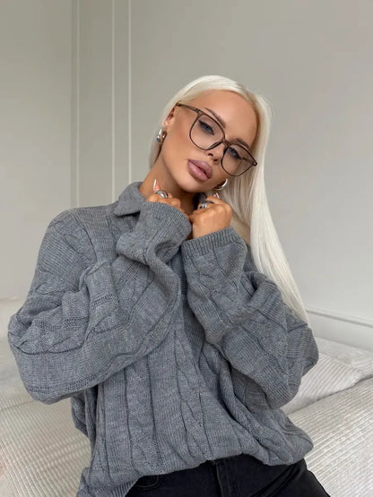 Graphite Sweater by Lauven showcasing a cozy oversized women’s cable knit design with V-neckline.