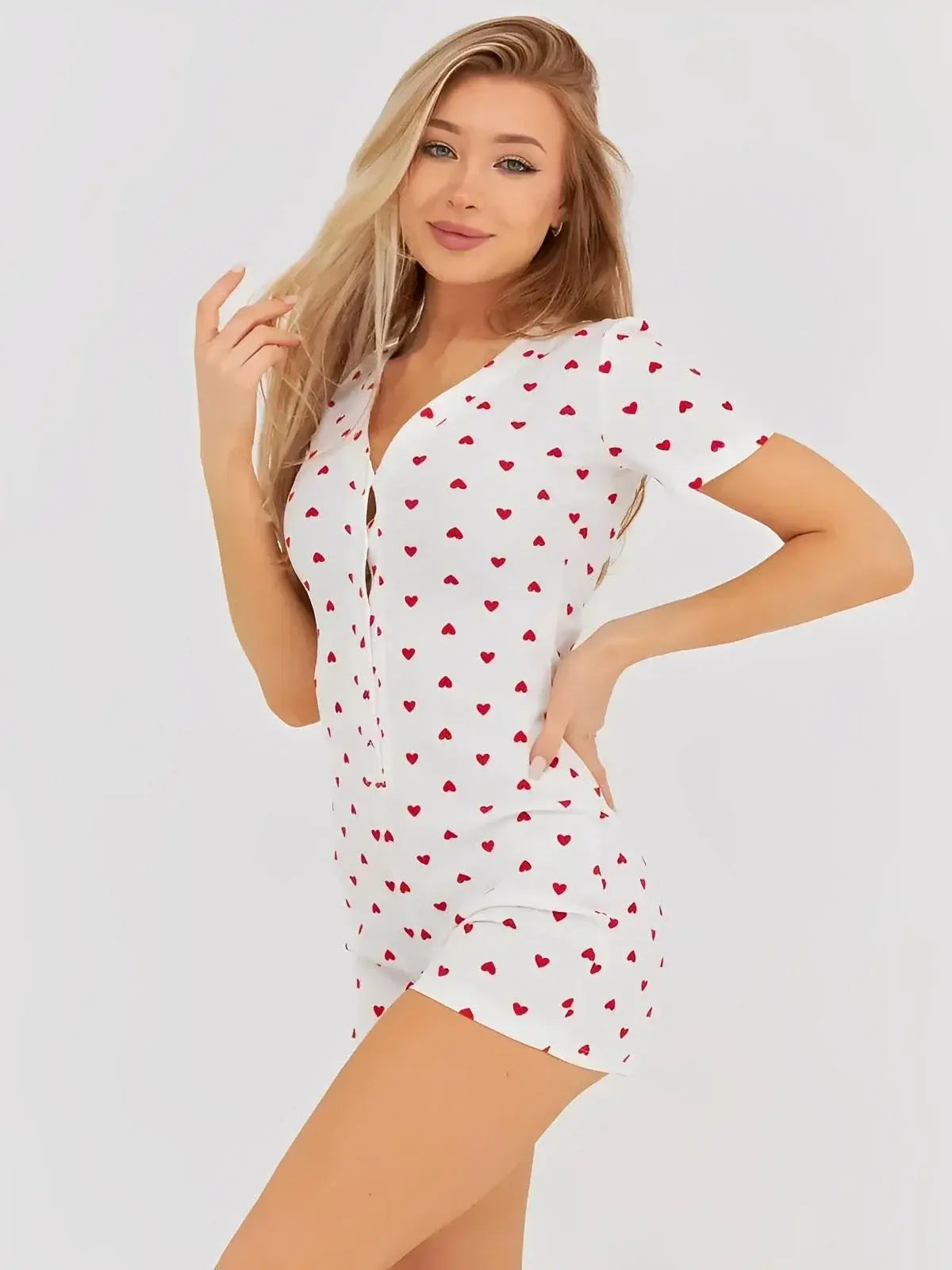 Heartprint Playsuit by Lauven, featuring a cheerful heart print, V-neck, and relaxed fit for stylish comfort.