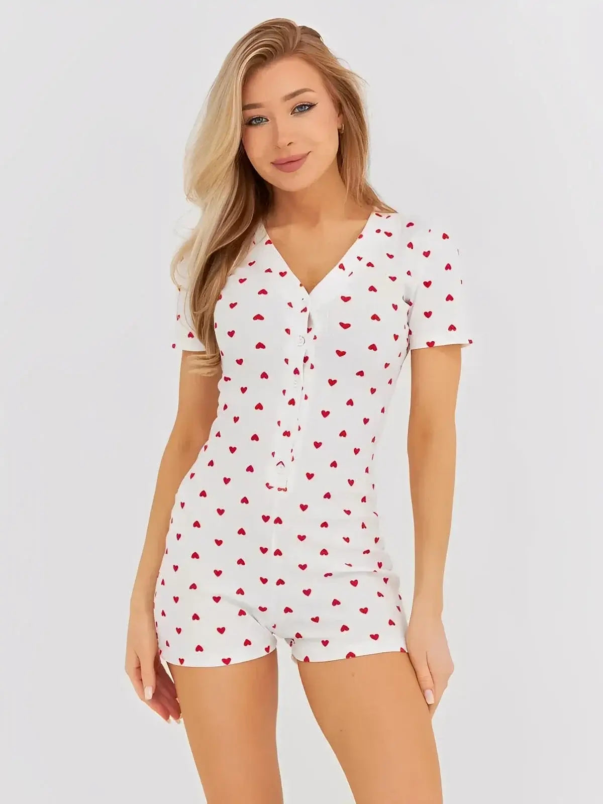 Heartprint Playsuit by Lauven featuring a V-neck and heart print, perfect for casual comfort.