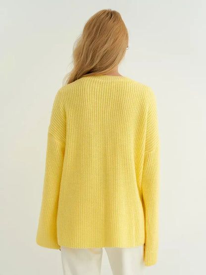 Back view of the Lemonade Sweater by Lauven, showcasing its oversized fit and soft lemon yellow knit.
