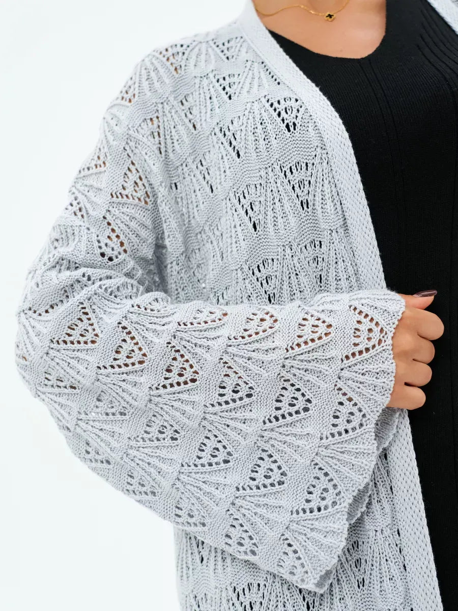 Mist Cardigan by Lauven featuring an intricate openwork design in soft light gray, perfect for summer layering.