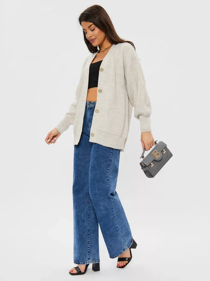 Linen Cardigan by Lauven worn with wide-leg jeans, showcasing a stylish light gray oversized knitwear look.