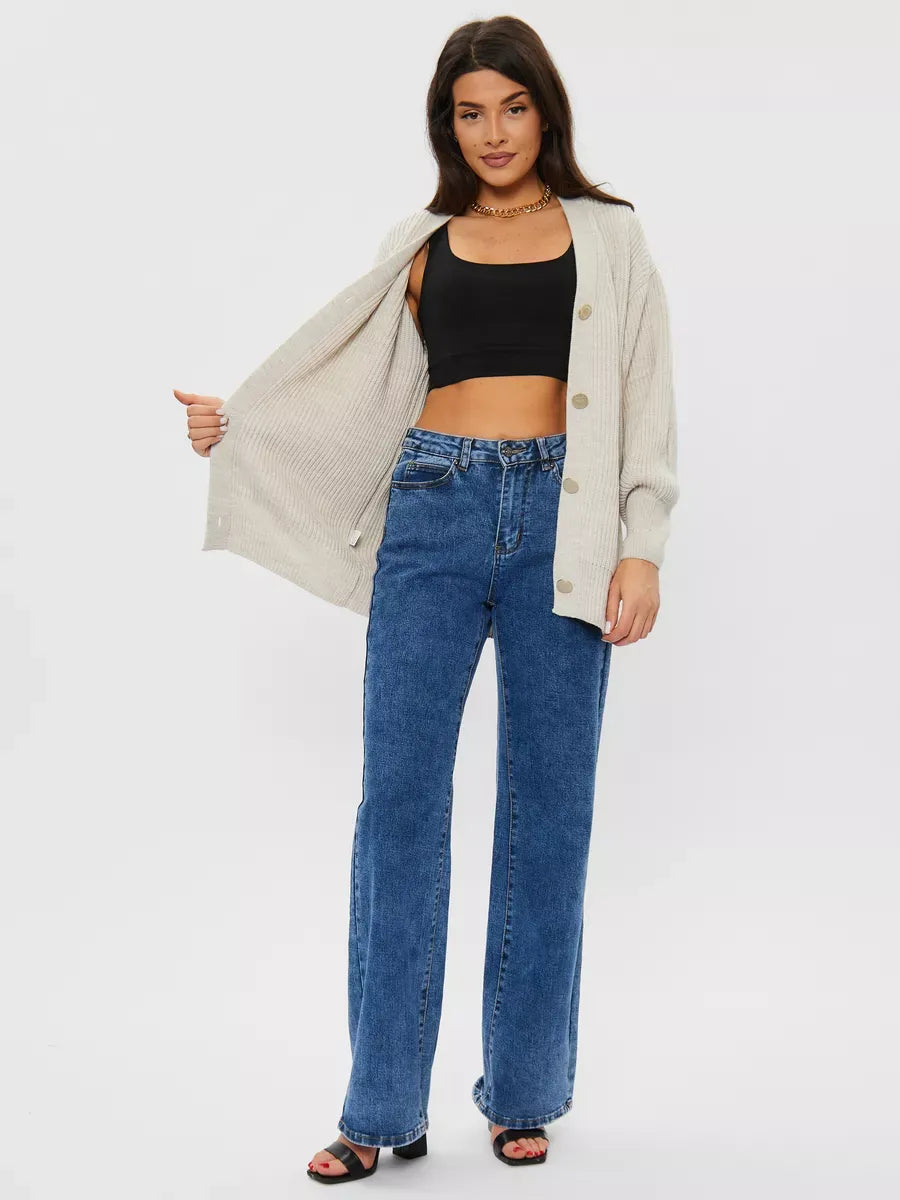 Linen Cardigan from Lauven styled with black top and blue jeans, showcasing oversized knitwear in light gray.