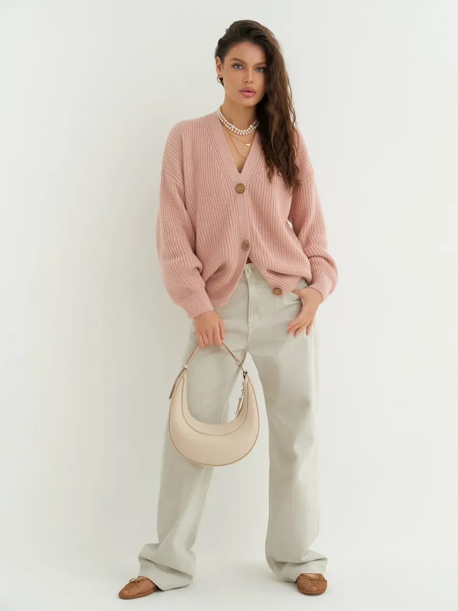 Liora Cardigan in soft powder pink oversized knitwear, styled with cream trousers and a handbag by Lauven.
