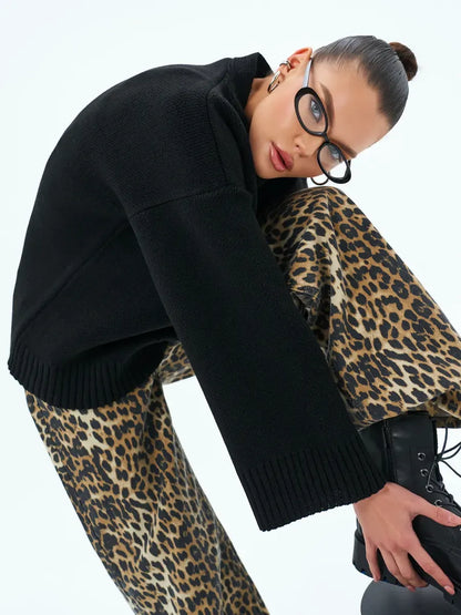 Luna Cardigan by Lauven, cozy oversized knitwear in black, styled with leopard print bottoms for a chic look.