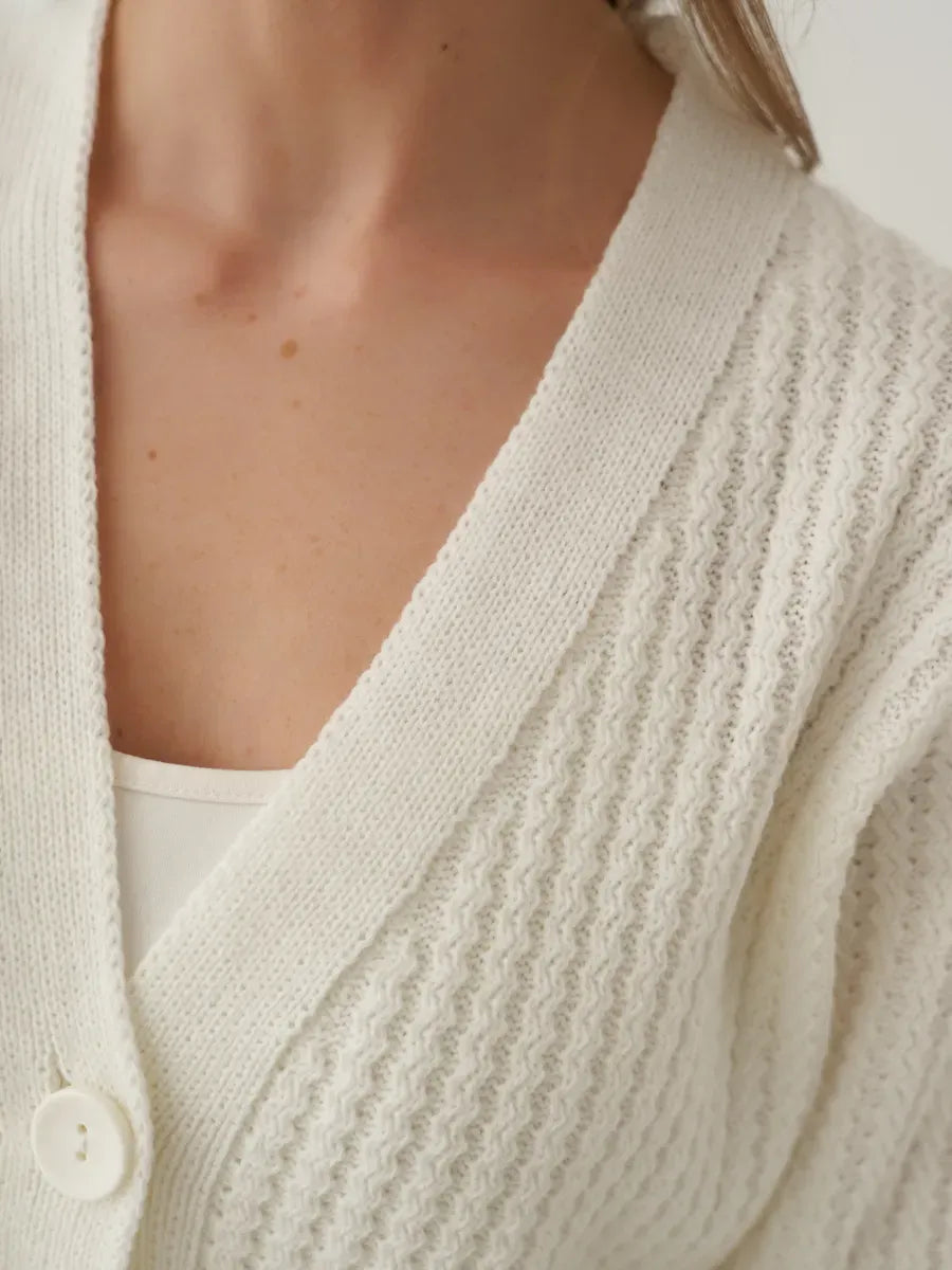 Luna Cardigan by Lauven: Oversized cropped knitwear in cream, featuring a button-front closure and textured design.