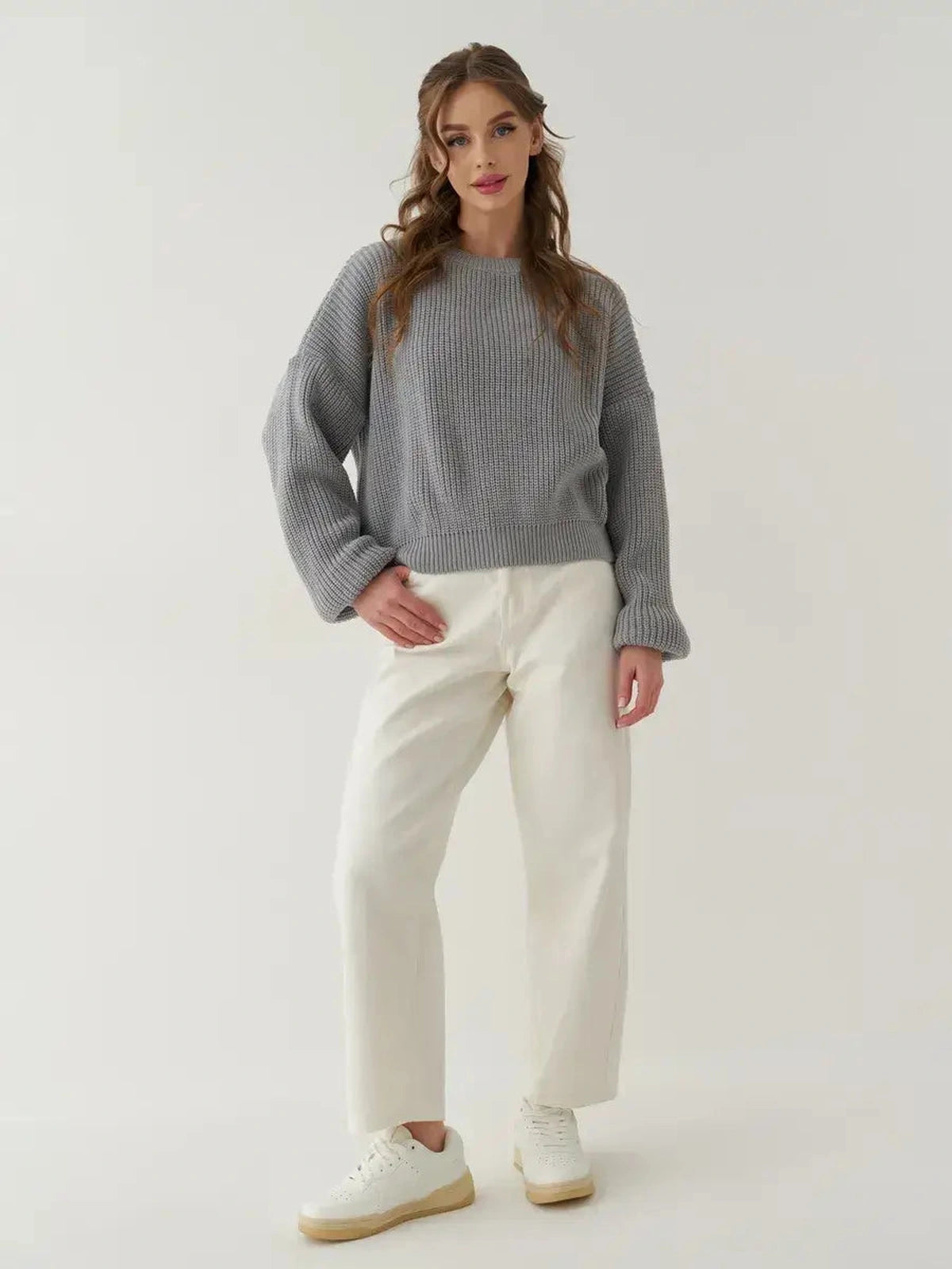 Luna Sweater by Lauven, oversized knit comfort in light grey worn with relaxed white trousers.