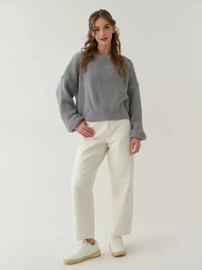 Luna Sweater by Lauven, oversized knit comfort in light grey worn with relaxed white trousers.