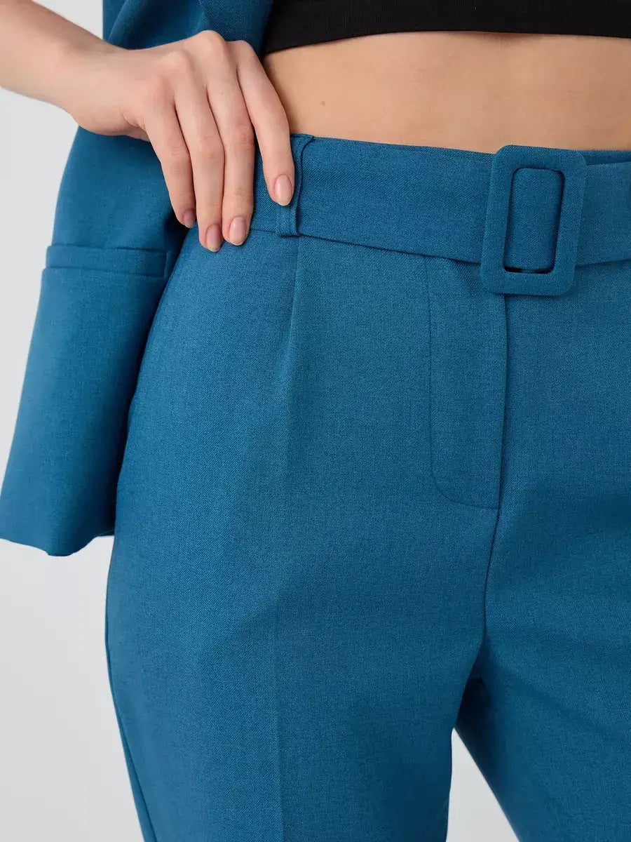 Marine Suit Set by Lauven – close-up of teal high-waist pants with stylish buckle detail.