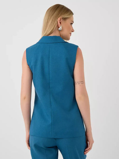 Back view of woman wearing Lauven Marine Suit Set sleeveless teal vest.
