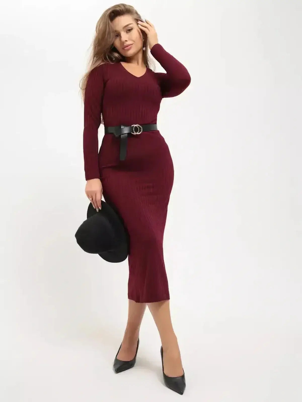 Model wearing the Merlot Grace Midi Dress by Lauven, showcasing a sleek design in deep burgundy with a trendy belt and hat.