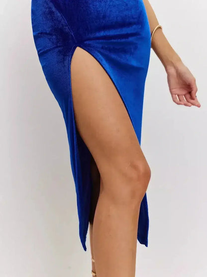 Close-up of thigh-high slit in Midi Dress Royal Flame by Lauven, showcasing plush sapphire blue velvet fabric.