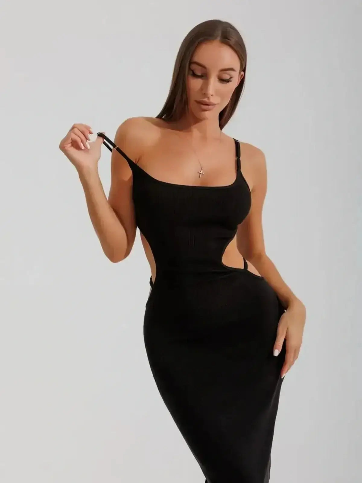 Midnight Silhouette Midi Dress by Lauven, featuring sensual cutouts and a body-sculpting fit in luxurious black knit.