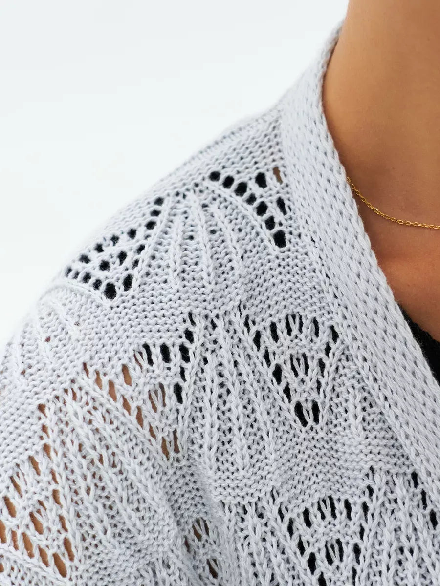 Mist Cardigan by Lauven showcasing intricate lace patterns in soft light gray.