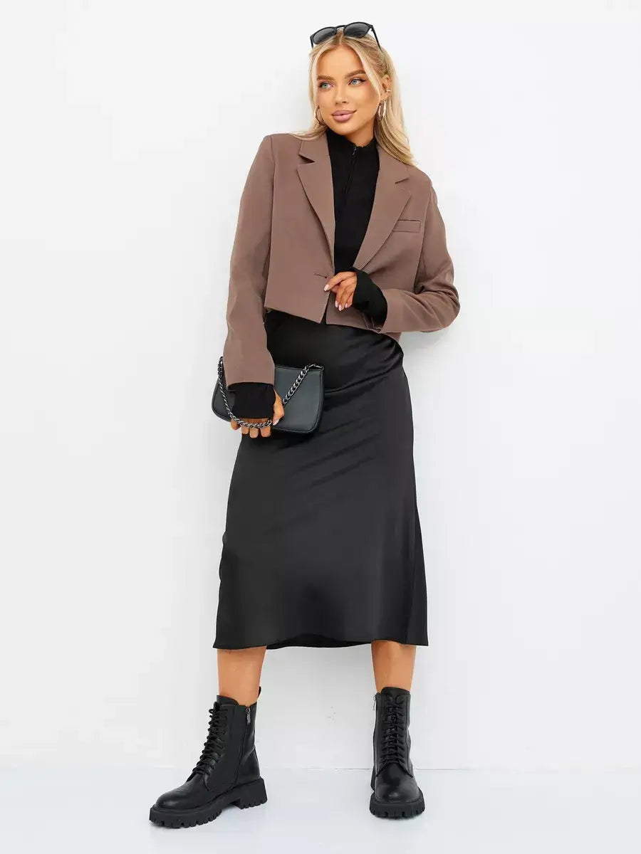 Mocha Blazer by Lauven styled with a black skirt and chunky boots for a chic, relaxed look.