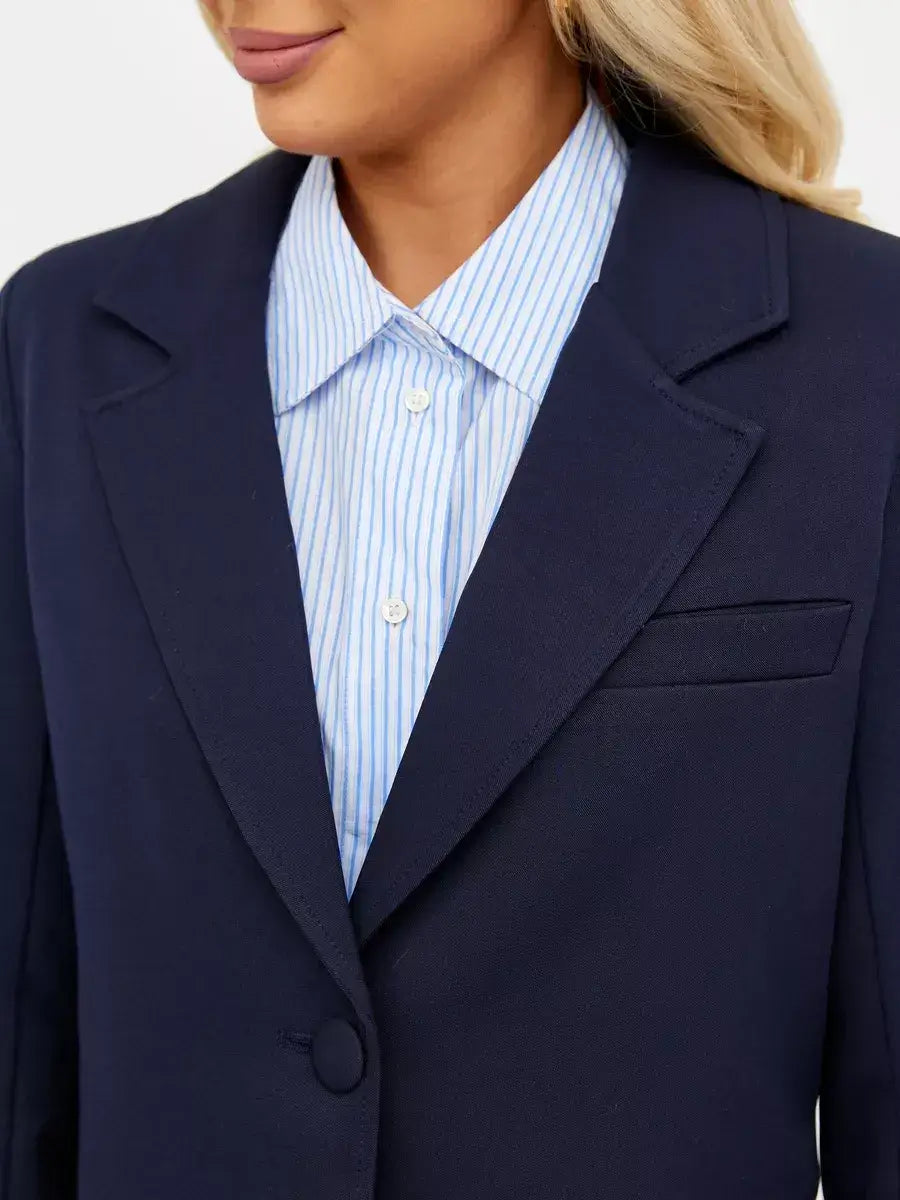 Navy Blazer by Lauven featuring a cropped tailored fit, stylishly paired with a striped shirt for classic elegance.