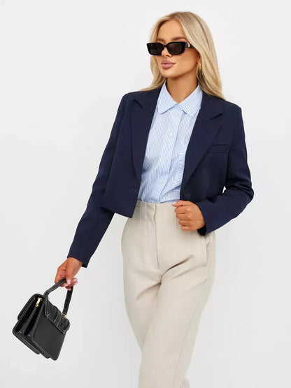 Navy Blazer by Lauven, cropped tailored elegance, worn with light blue shirt and beige pants, perfect for versatile styling.