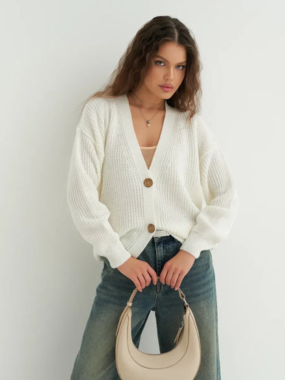Noelle Cardigan by Lauven, elegant white knitwear with button detailing, perfect for layering and versatile looks.