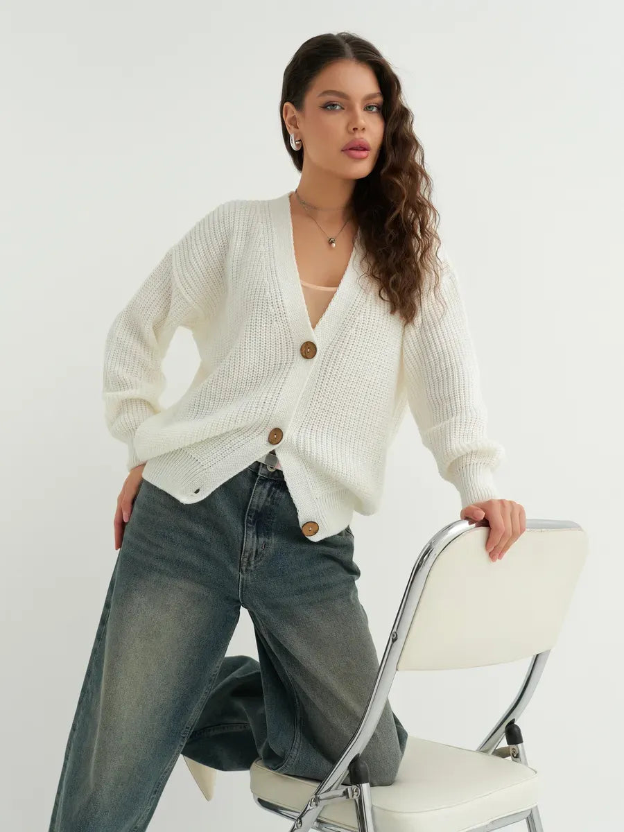 Noelle Cardigan by Lauven - Elegant white knitwear with button detailing, perfect for layering and versatile styling.
