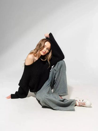 Lauven Noir Sweater oversized off-shoulder knit in classic black, styled with relaxed pants.