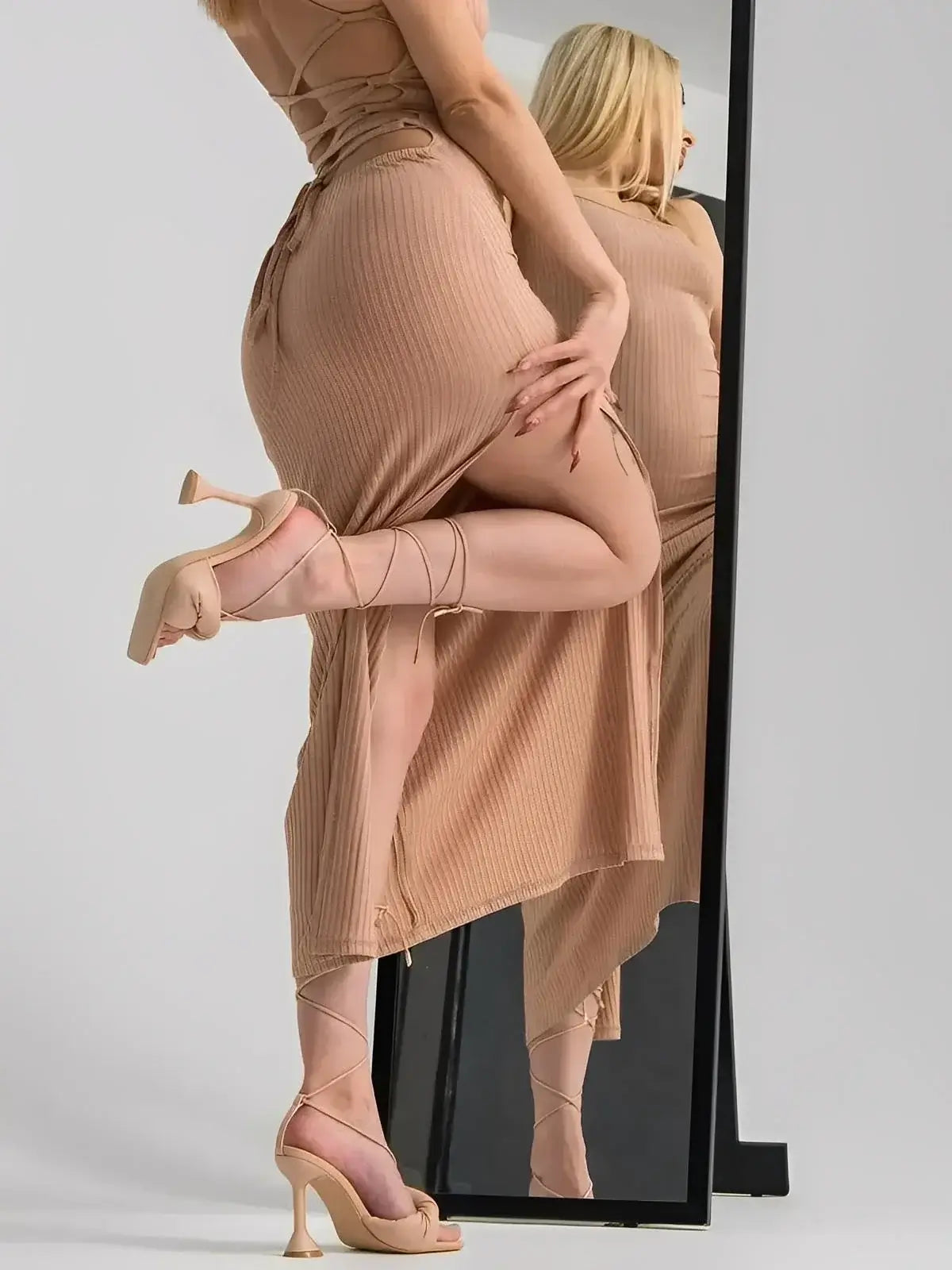 Nude Lace Midi Dress by Lauven, featuring a strappy bodycon silhouette and thigh-high slit for stylish allure.