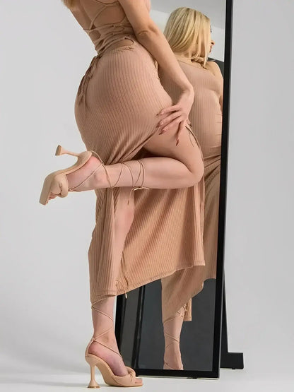 Nude Lace Midi Dress by Lauven, featuring a strappy bodycon silhouette and thigh-high slit for stylish allure.