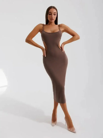 Elegant model showcasing the Lauven Obsidian Curve Midi Dress with side cut-outs and a sleek silhouette.
