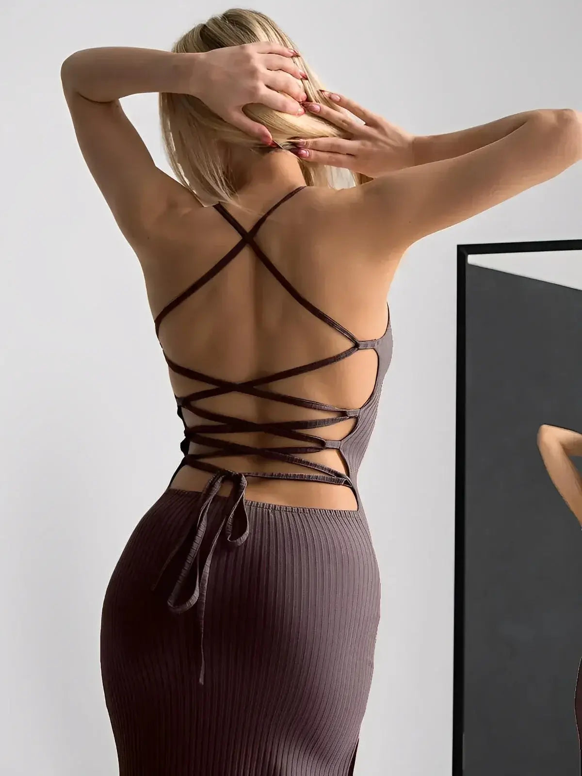 Obsidian Midi Dress by Lauven showing strappy back design and elegant silhouette.