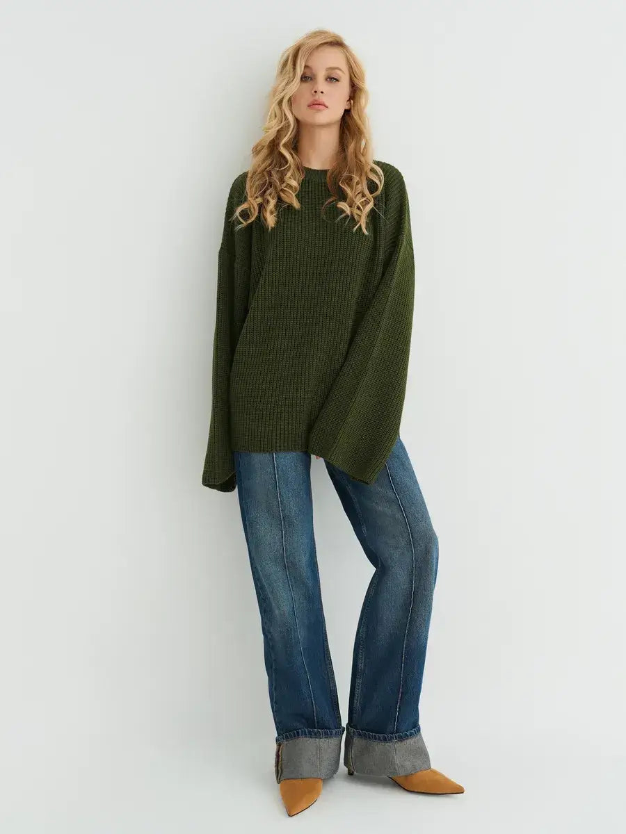 Olive Sweater from Lauven in oversized knit, deep khaki, styled with wide sleeves and relaxed jeans.