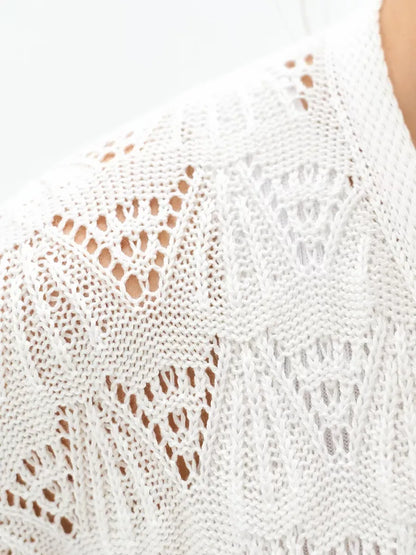 Pearl Cardigan by Lauven, showcasing the intricate openwork knit design in creamy white.