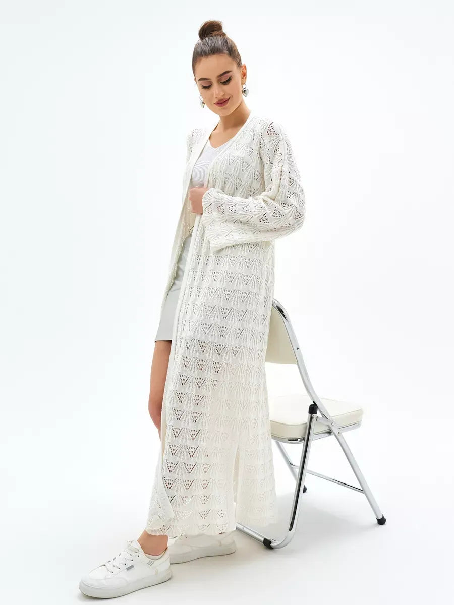 Woman modeling Pearl Cardigan by Lauven, a lightweight openwork knit cardigan perfect for summer.