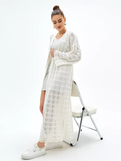 Woman modeling Pearl Cardigan by Lauven, a lightweight openwork knit cardigan perfect for summer.